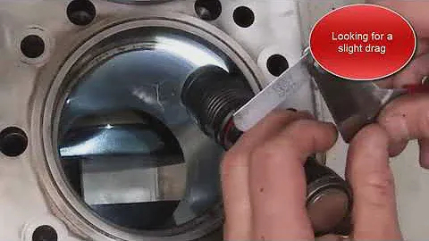 Measuring piston ring end-gap on an engine Cat