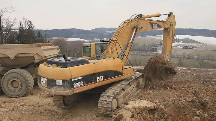 CAT 330C loads Volvo A40D