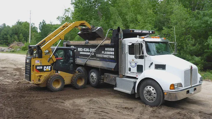 Caterpillar 262D Loading Tri Axle