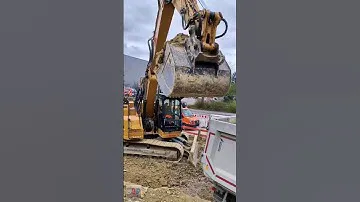 Caterpillar 325 Next Generation loads a tipper trailer, 2023. #1